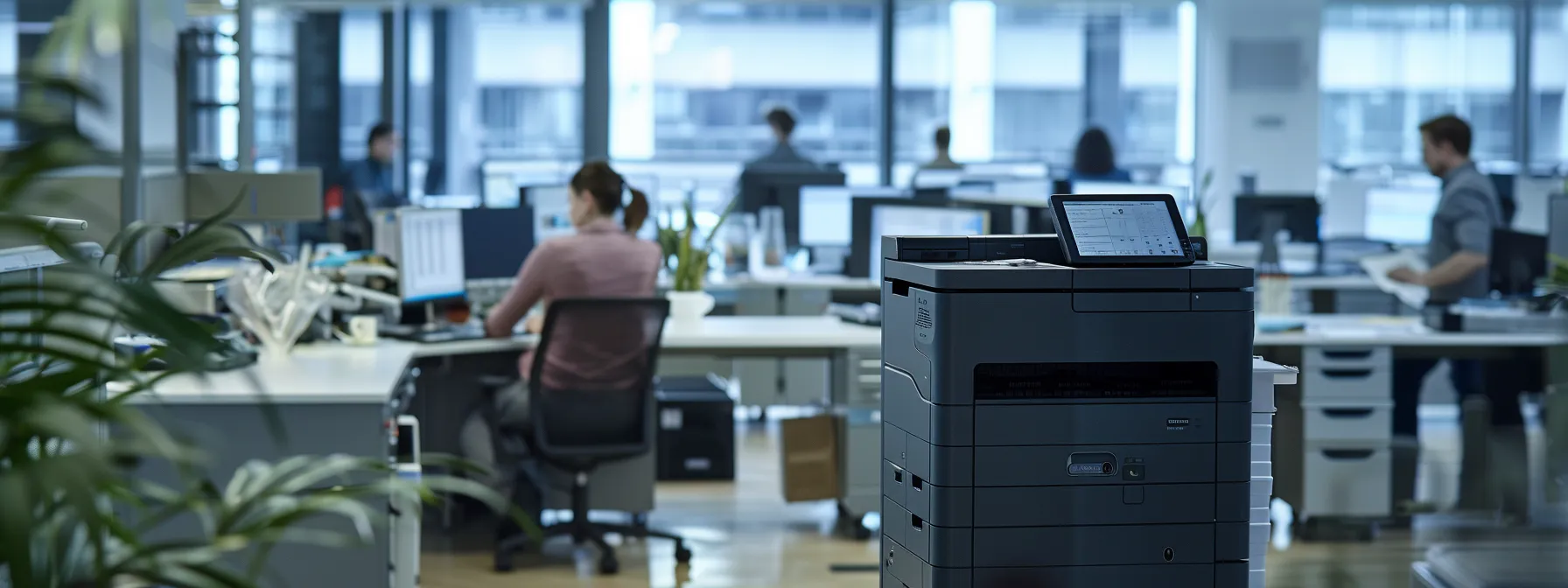 a sleek, modern printer in a bustling office setting, surrounded by busy employees working efficiently.